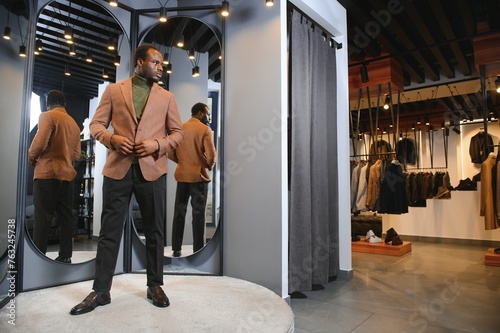 African businessman in elegant classic suit in a premium men's clothing store