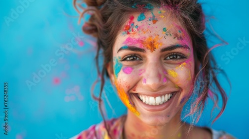 Woman Smiling With Colorful Paint on Face