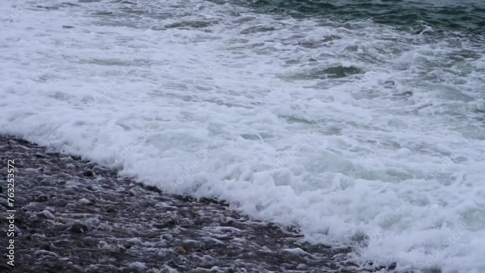 Video of turbulent waves crashing in a stormy sea, captured on a gloomy day. Video of turbulent waves crashing in a stormy sea, captured on a gloomy day.