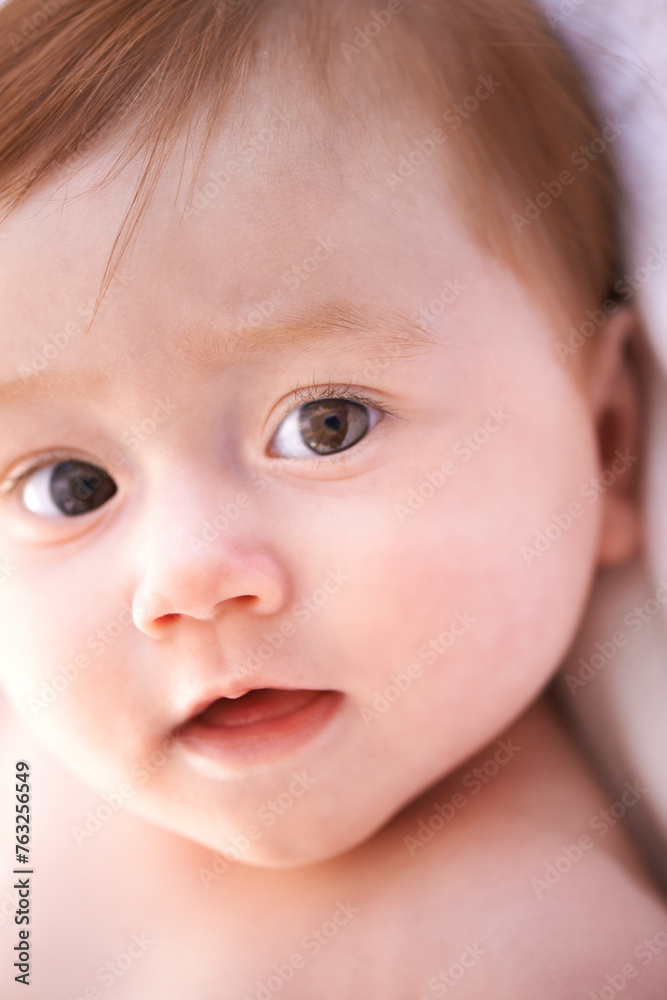 Closeup, kid and baby on bed with thinking for childhood development, growth and relax at home. Newborn, ginger and girl with curiosity for knowledge, wonder or waking up in nursery from above Closeup, kid and baby on bed with thinking for childhood development, growth and relax at home. Newborn, ginger and girl with curiosity for knowledge, wonder or waking up in nursery from above