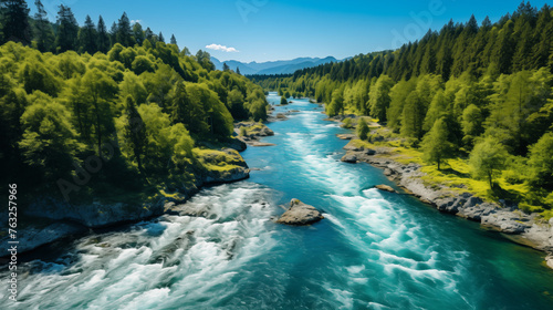 Vivid Blue River Cutting Through Lush Forested Landscape