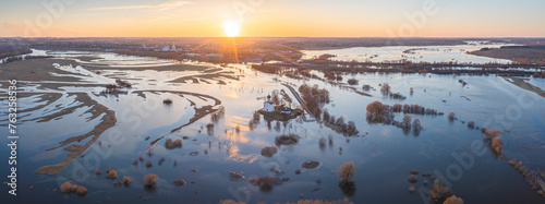 Aerial view of Church of the Intercession on the Nerl surrounded by flooded Nerl river and beautiful Russian landscape, Bogolyubovskoe, Vladimir, Russia. photo
