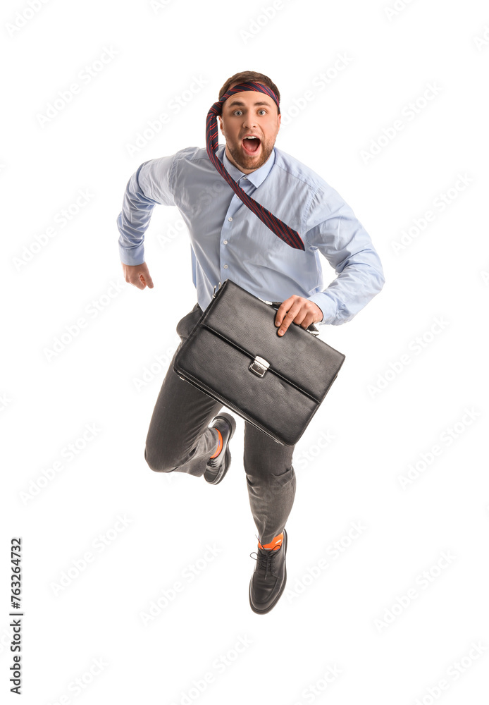 Funny businessman with necktie around his head and briefcase jumping on white background Funny businessman with necktie around his head and briefcase jumping on white background