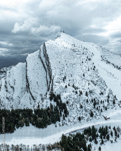 Aerial view of snowy Mount Boldone and Palon peak in the scenic alps, Trentino, Italy. photo