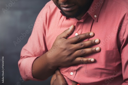 the discomfort of a man suffering from heartburn photo