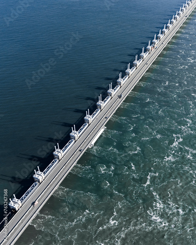 Aerial drone view of storm surge barrier Oosterscheldekering, bridge and water barrier, The Netherlands. photo