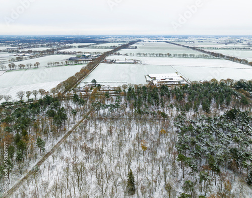 Aerial view of mixed forest and countryside in autumn with snow, De Witte Bergen, Asten, De Peel, Noord-Brabant, Netherlands. photo