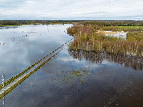 Aerial view of flooded bicycle path and grassland during high water of river Vecht, Diffelen, Vechtdal, Overijssel, Netherlands. photo