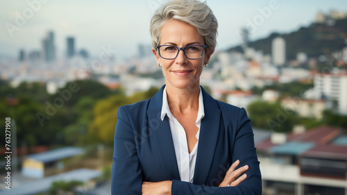 Business woman, face and senior, lawyer happy with career and confident on rooftop, skyscraper and pride. 