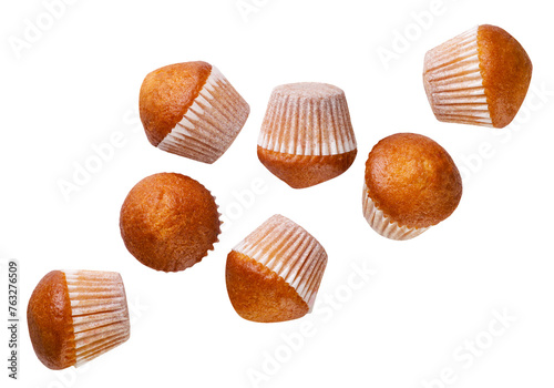 Set of cupcakes falling on a white background. Isolated