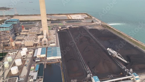 Heavy industrial coal power electricity plant with chimney and pipes, lignite coal product mass ready to be energy for electricity power plant