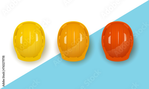 Set of three realistic construction helmets in different colors. Vector illustration.