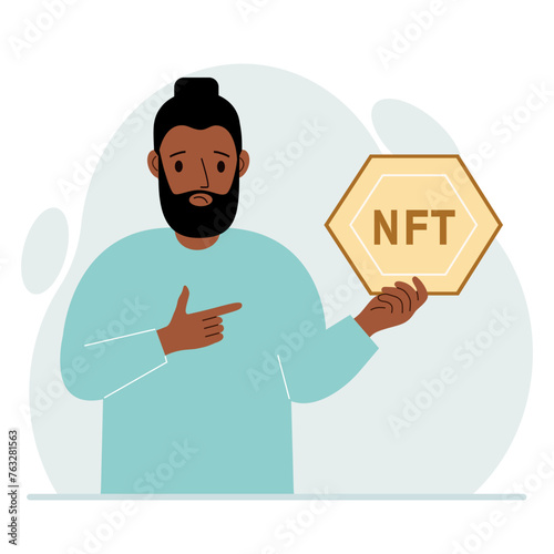NFT concept. The man is holding nft in his hand. Works of art using non-fungible tokens for auctions, sale and purchase of works of art.