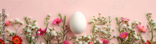 A Beautiful Egg Centerpiece Nestled Amidst a Ring of Colorful Spring Flowers.