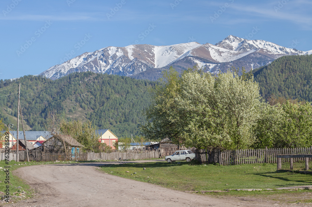 Rural landscape, village in the mountains of Altai, summer travel