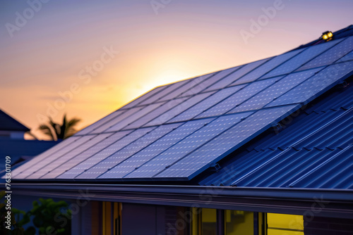 Blue solar panels atop a house roof during dusk, sustainable living, clean energy solutions and environmental consciousness