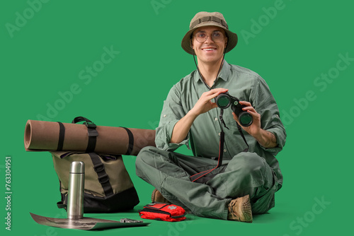 Male traveler with binocula...