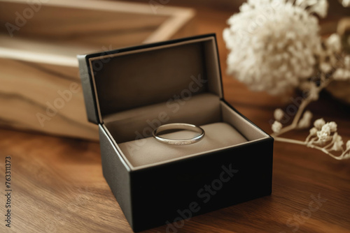 Single wedding ring in a luxurious velvet box, symbolizing commitment and love © Татьяна Евдокимова