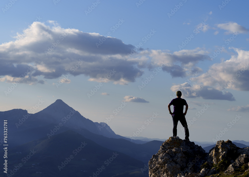 Mount Orkatzategi. Hiker on Mount Orkatzategi with Mount Anboto in the background, euskadi Mount Orkatzategi. Hiker on Mount Orkatzategi with Mount Anboto in the background, euskadi