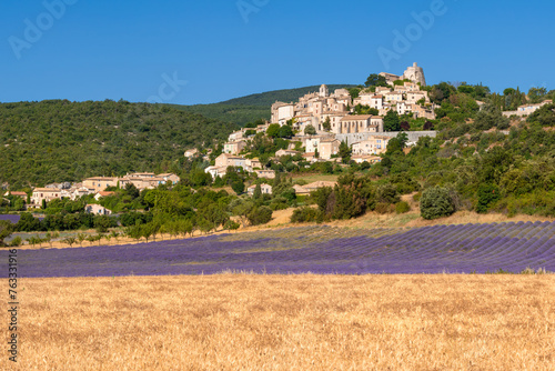 The Provence hilltop village of Simiane-la-Rotonde with lavender field in summer. Alpes-de-Hautes-Provence, France
