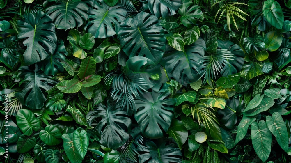 Dense greenery with varied tropical leaves, presenting shades of green and intricate patterns, perfect for nature and environment designs. Seamless pattern