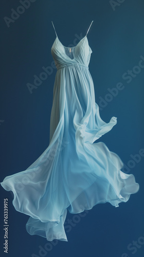 Light blue or white wedding or ball gown dress flying in the air blue background vertical