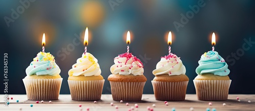Five cupcakes with candles and Several cupcakes on a wooden cutting board with a Happy Birthday candle