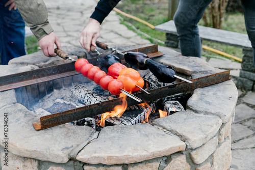 Tomatoes, eggplant and sweet peppers on skewers.