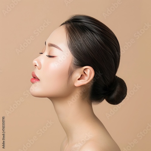 Pretty woman of Asian appearance makeup luxury charm beige background, picture from the side