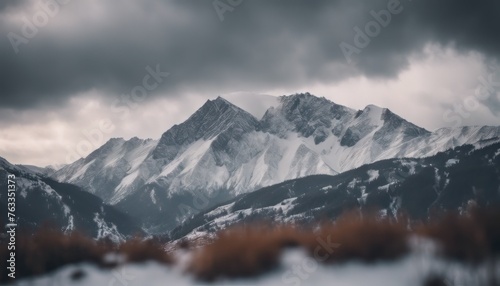 Mountain covered in snow under a cloudy sky © Adi