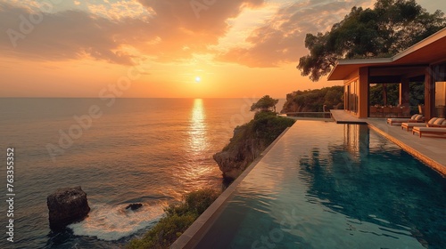 Luxurious Villa Overlooking Serene Ocean at Sunset. © Sandris
