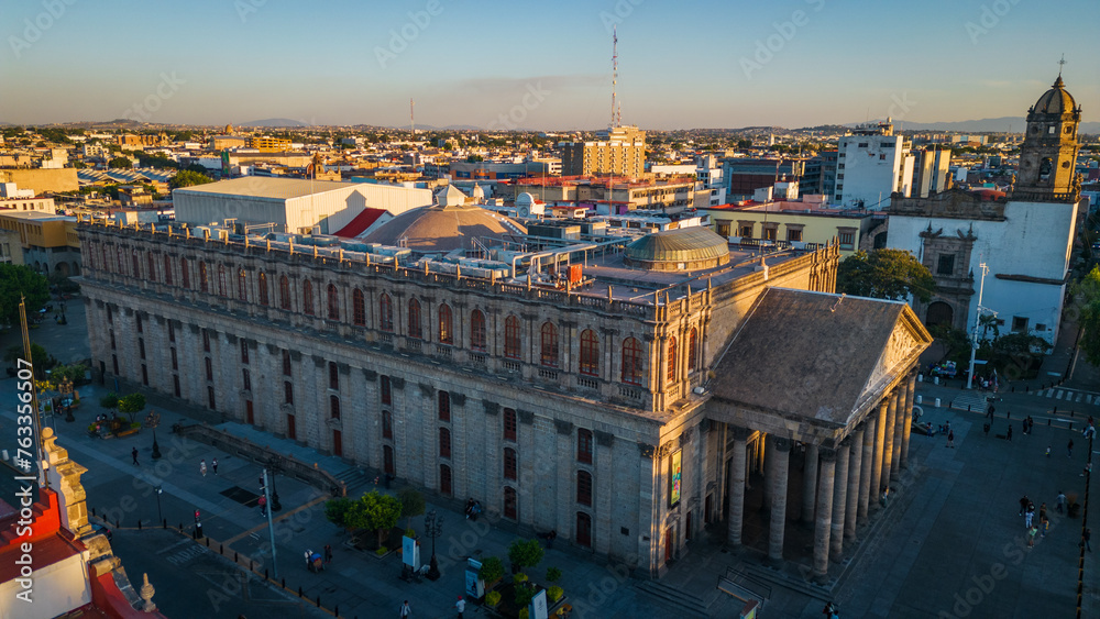 drone rotate around main cathedral square at sunset in Guadalajara Jalisco capital cityscape Mexico aerial 