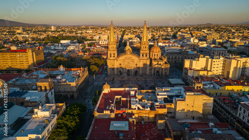 Aerial Drone Guadalajara Mexico Church landmark Travel City historic center, Roman Catholic Building Architecture in Sunset around local traditional houses © Michele