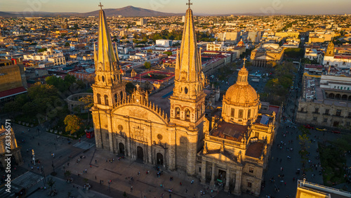 Aerial Drone Fly Above Guadalajara Mexico Church landmark Travel City historic center, Roman Catholic Building Architecture in Sunset around local traditional houses	