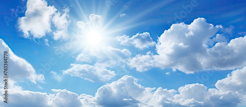 Sunny day view of sun and c...
