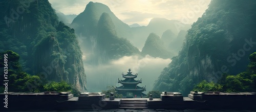 A pagoda in misty mountains and an ancient temple for Buddha prayer photo