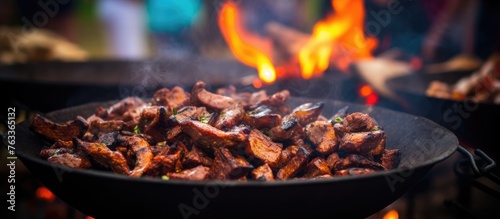 Food sizzling on a grill up close
