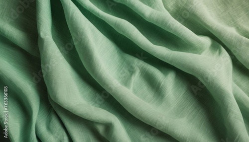 Linen green fabric. Natural fabrics as a background. Beautiful natural green background. Linen fabric.