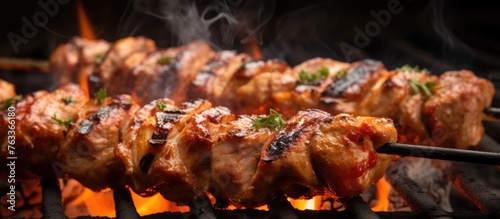 Close-up grill skewered mea...