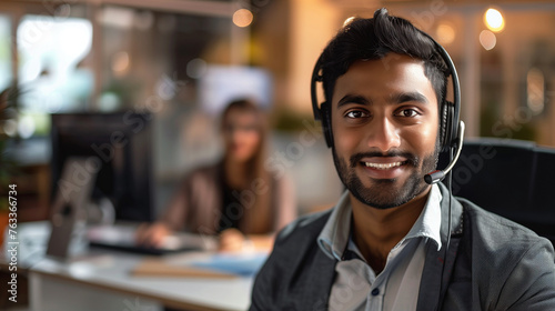 Confident indian businessman wearing headset in modern office - corporate professional