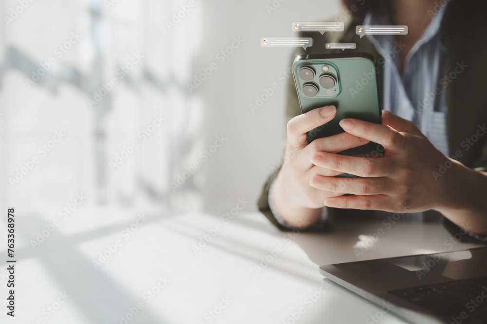 Person typing messages, business people typing messages via online messaging app, sending data and chatting via wireless internet network. The concept of using wireless technology in communication.