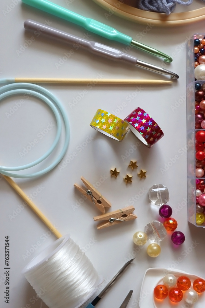 Various craft supplies on white background. Supplies for jewelry making, drawing and needlework. Flat lay. Various craft supplies on white background. Supplies for jewelry making, drawing and needlework. Flat lay.