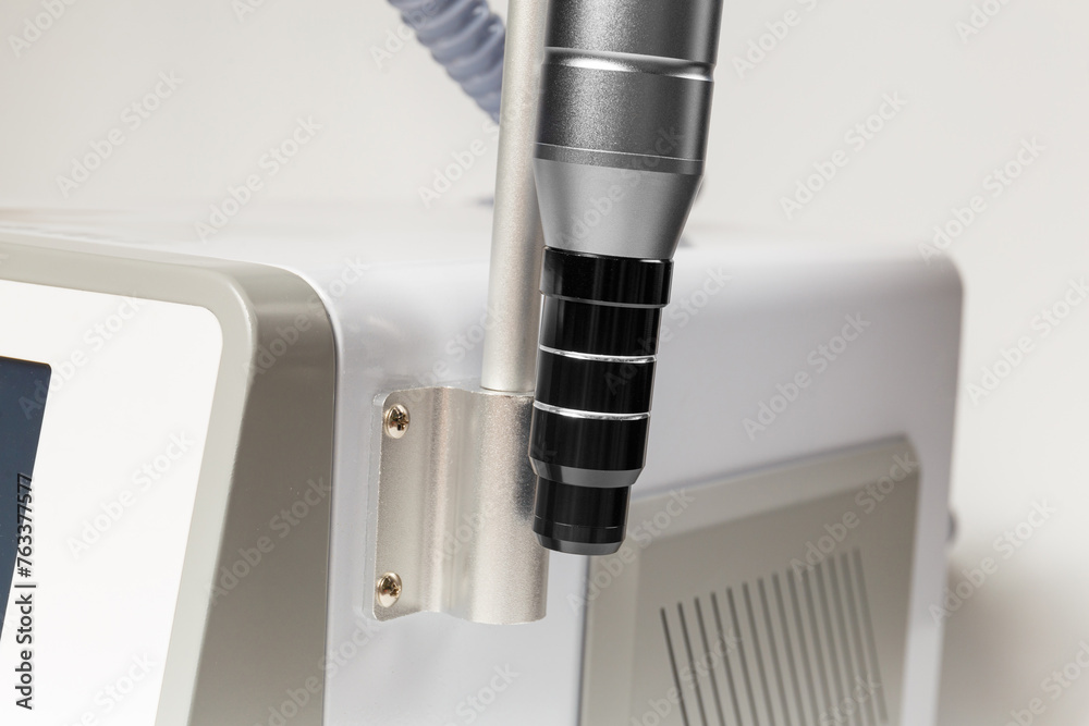 Close-up of a neodymium laser handpiece with an attachment for carbon peeling. Close-up of a neodymium laser handpiece with an attachment for carbon peeling.
