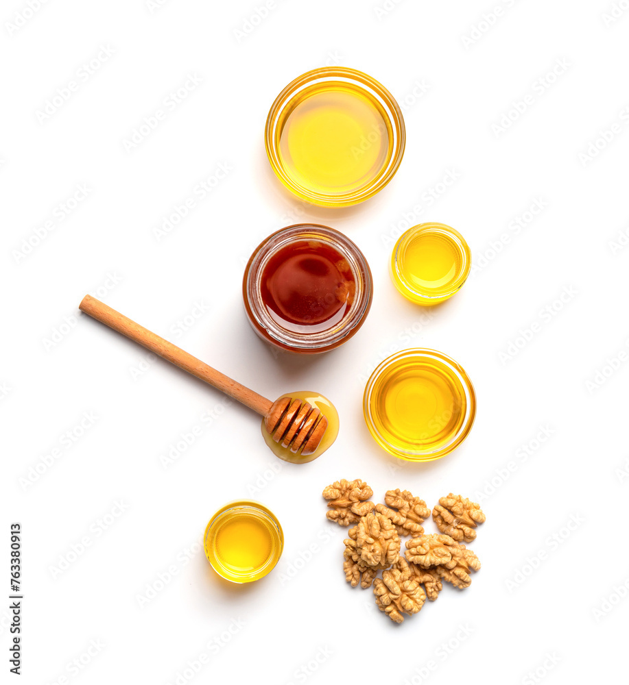 Honey and walnuts on a white background top view Honey and walnuts on a white background top view