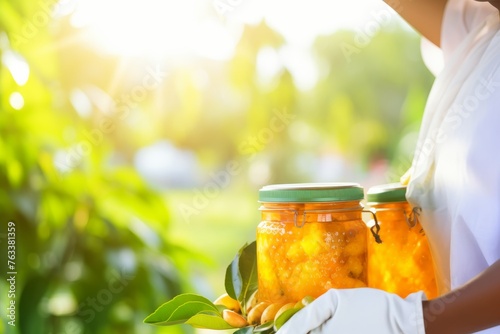 beekeeper proudly holding jar of golden honey against vibrant blurred background photo