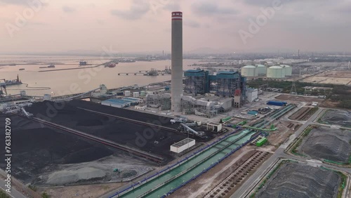 Heavy industrial coal power electricity plant with chimney and pipes, lignite coal product mass ready to be energy for electricity power plant