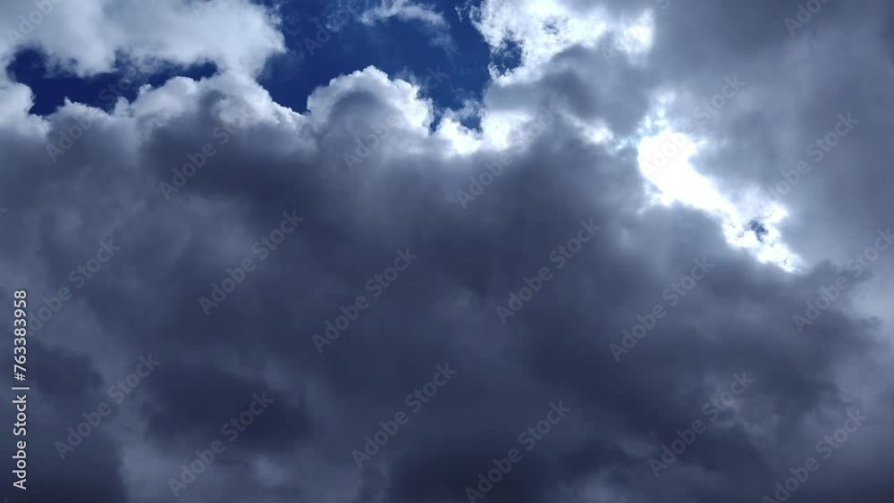 Huge jet-colored cumulus moves with the light Huge jet-colored cumulus moves with the light