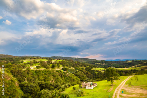 Green fields and blue sky surrounded by valleys in arcos del sitio in tepotzotlan state of mexico