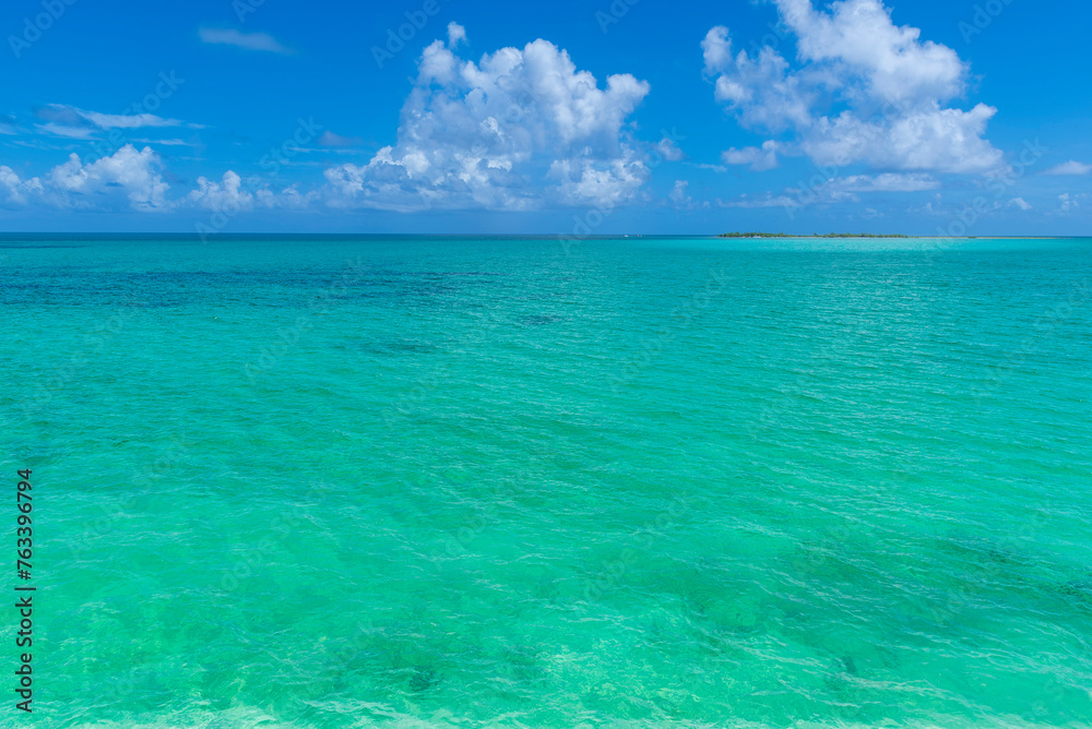Beautiful turquoise water of the Caribbean Sea on a bright sunny day and the horizon and blue sky in the distance; Cayo Guillermo, Cuba Beautiful turquoise water of the Caribbean Sea on a bright sunny day and the horizon and blue sky in the distance; Cayo Guillermo, Cuba