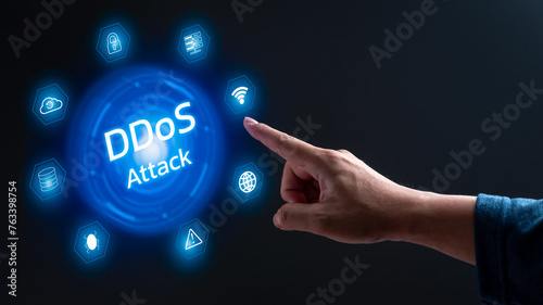 A hand pointing to a blue circle with the word ddos attack in white